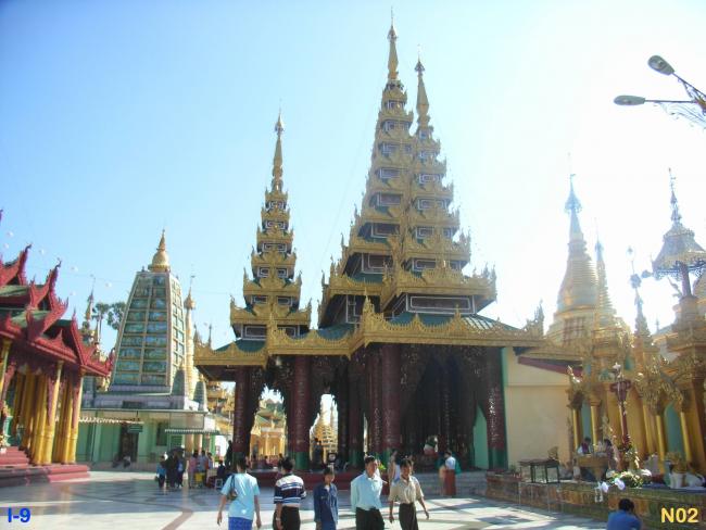 Temple of the Gautama Buddha. Tazaung's view from the west. ( Flanked by Planetary post for Venus; associated with Friday born persons. Mahabodhi Pagoda can be seen further south.