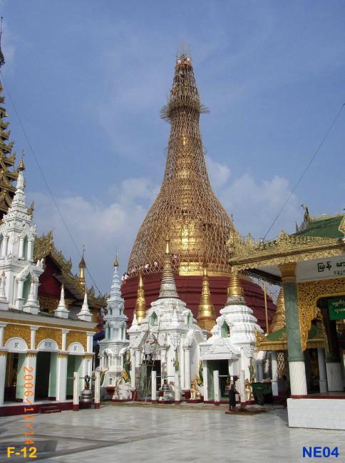 Naungdawgyi Pagoda with scaffolding around it. ( Pagoda being setup for re-gilding. Note the relative size of workers at the Hti ( very top ) level of the Pagoda. )