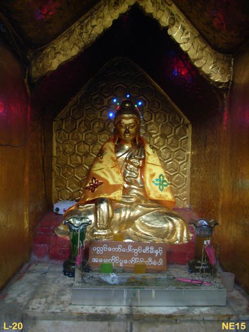Shrine located within a right side small cave of the Dhammazeadi Temple. ( Buddha statue is not protected by glass barrier, and the nose got rubbed.)