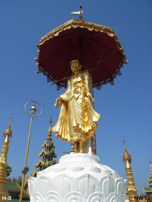 Buddha statue atop the above the pagoda circled by small shrines.